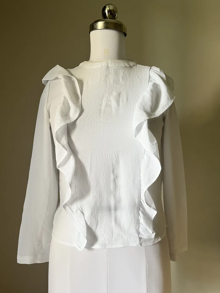 White ruffle shirt-style top