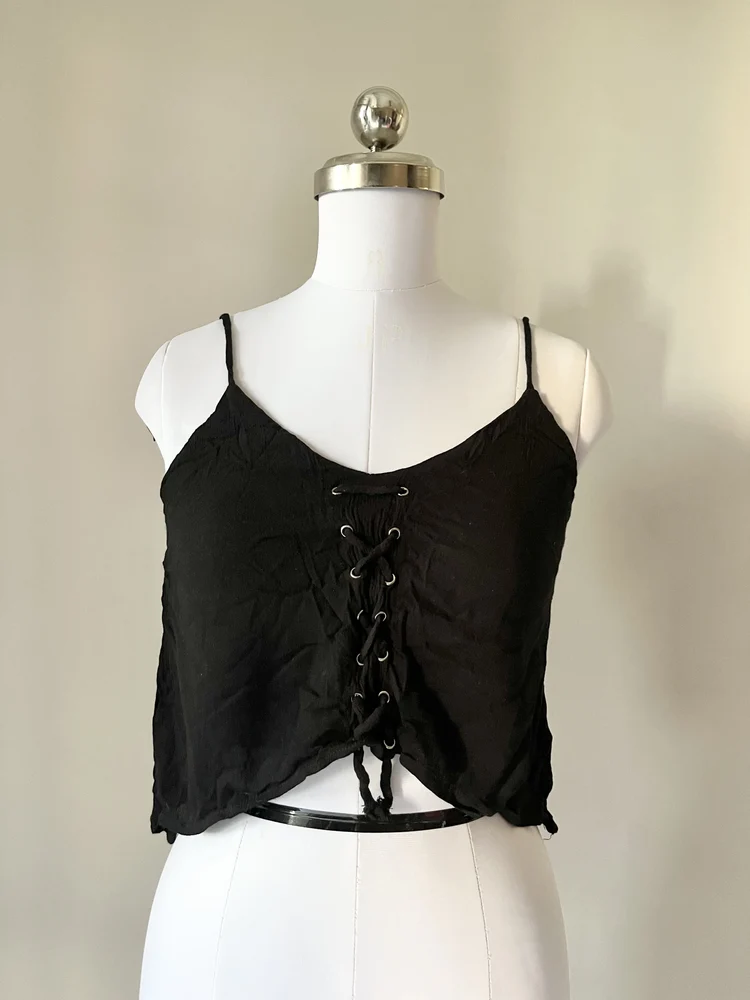 Dip hem black eyelet top
