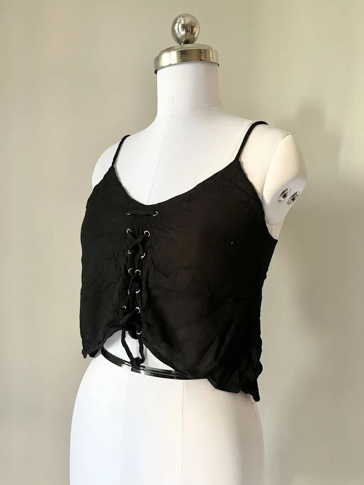 Dip hem black eyelet top
