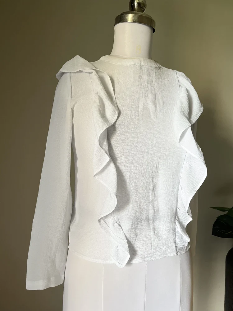 White ruffle shirt-style top