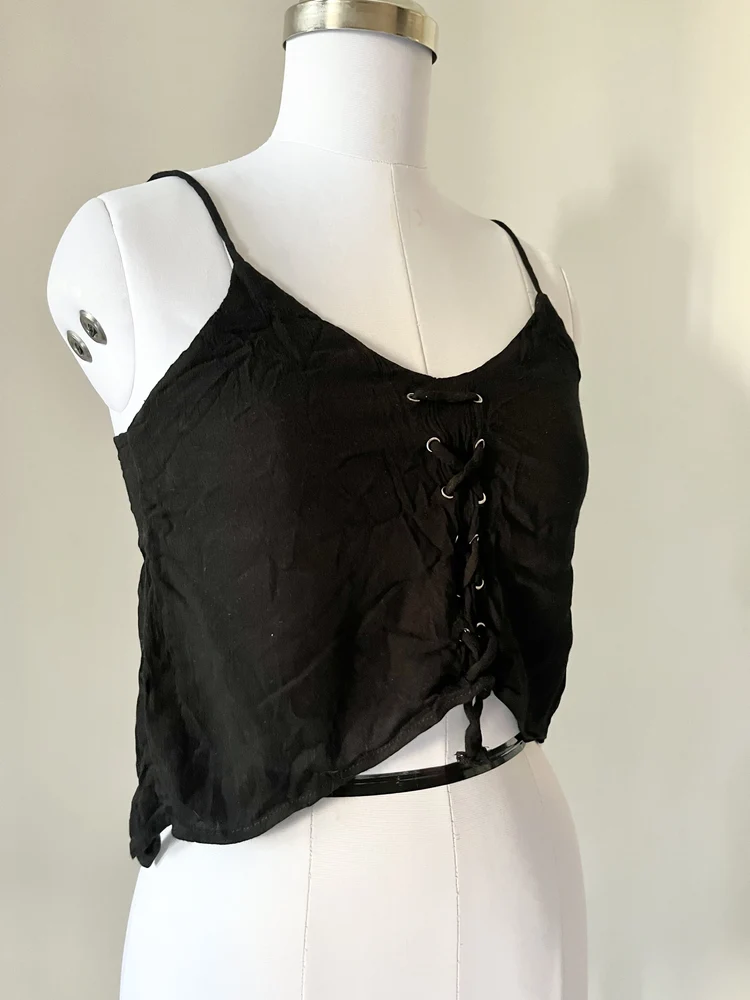 Dip hem black eyelet top