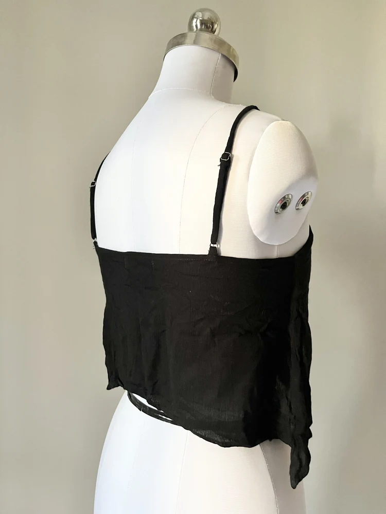 Dip hem black eyelet top