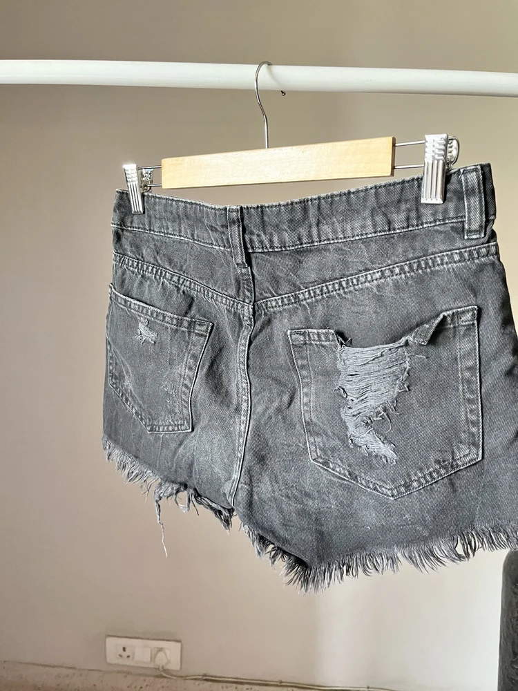 Black ripped shorts