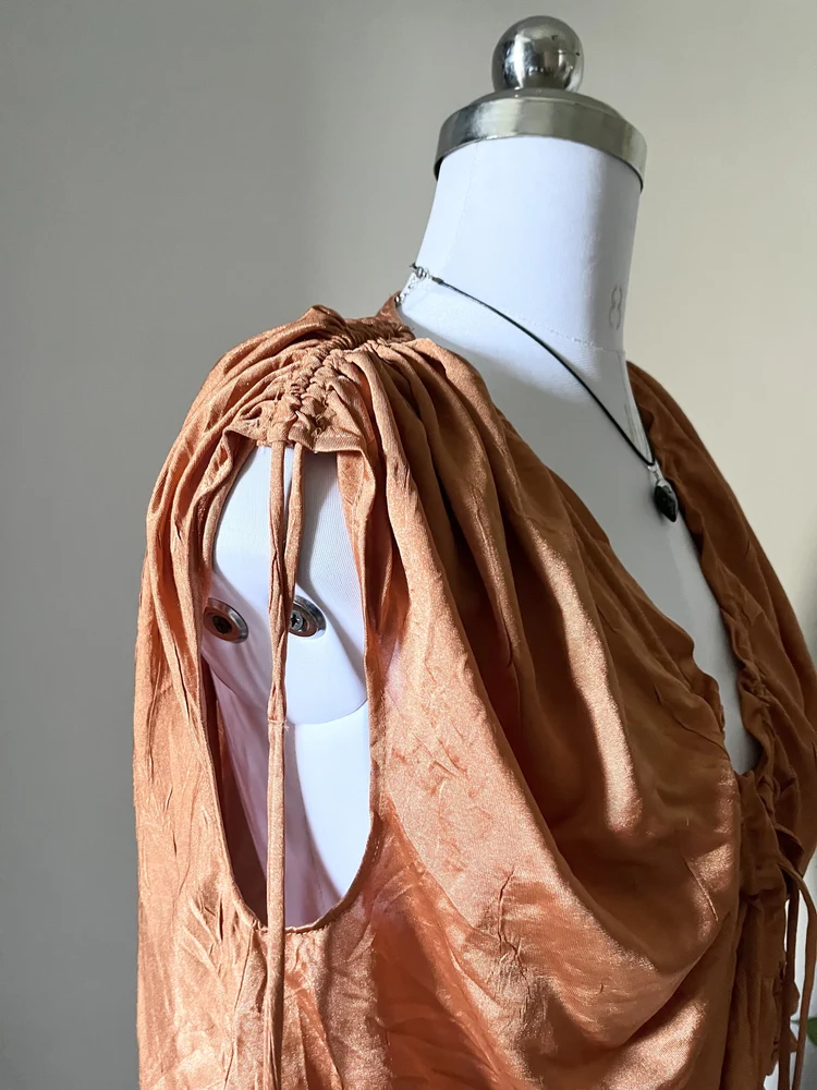 Orange Shrug style top 